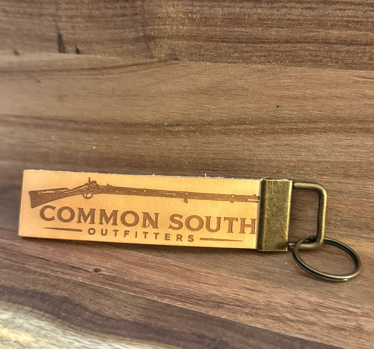 Common South Outfitters leather keychain engraved with a vintage rifle